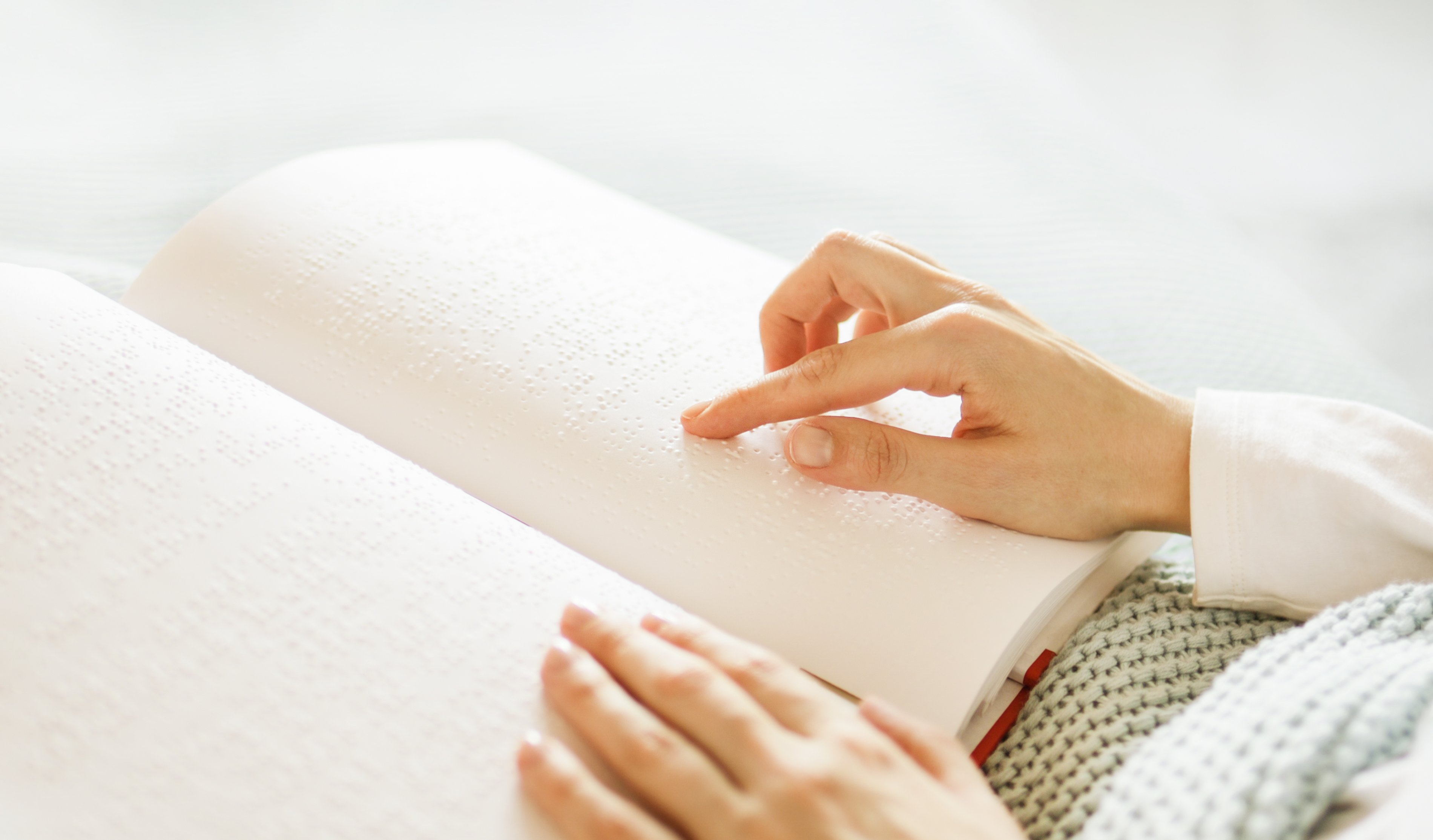 poorly-seeing-woman-learning-braille-book-2023-11-27-05-31-46-utc