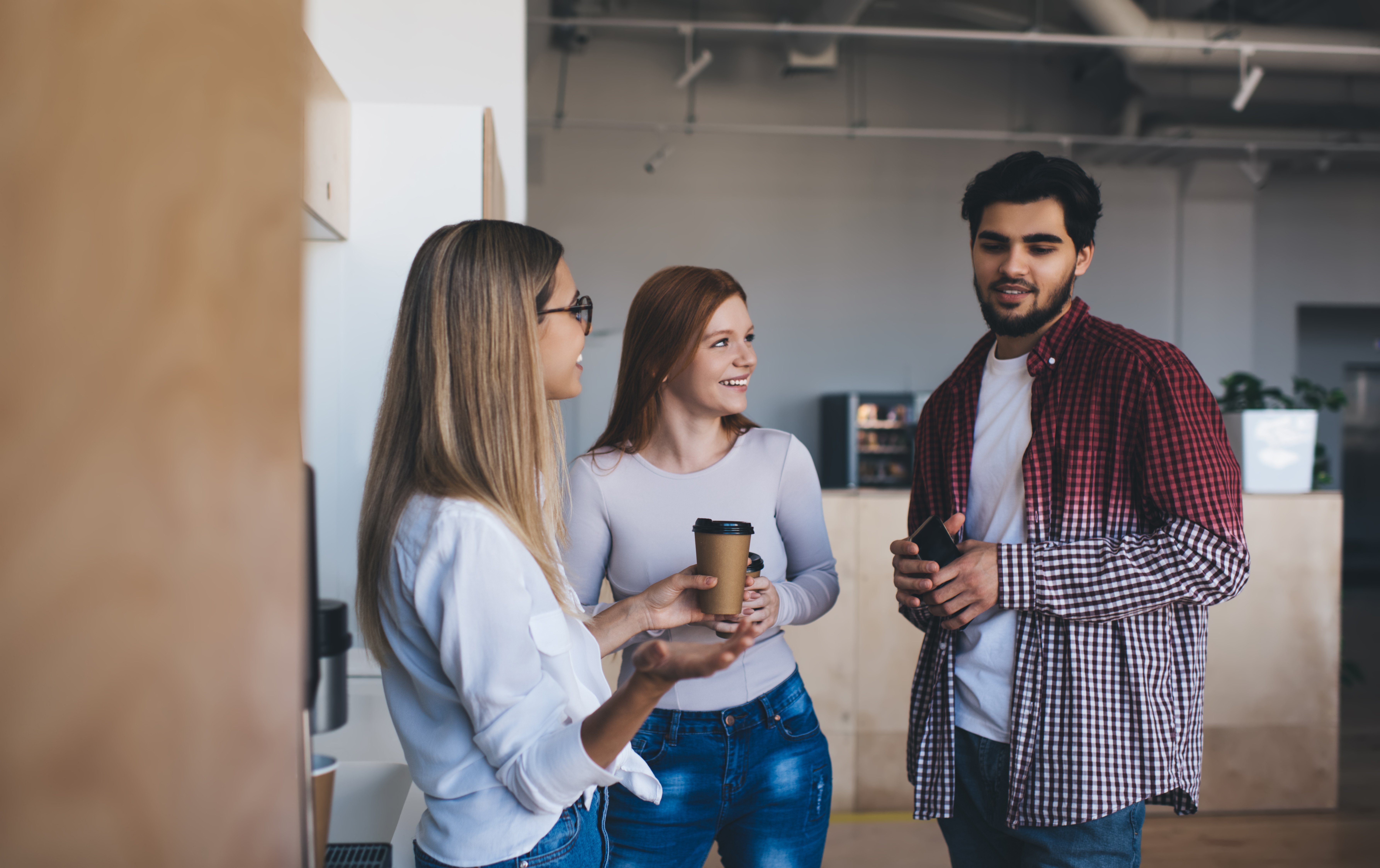 positive-colleagues-drinking-coffee-in-office-2024-01-23-19-02-09-utc
